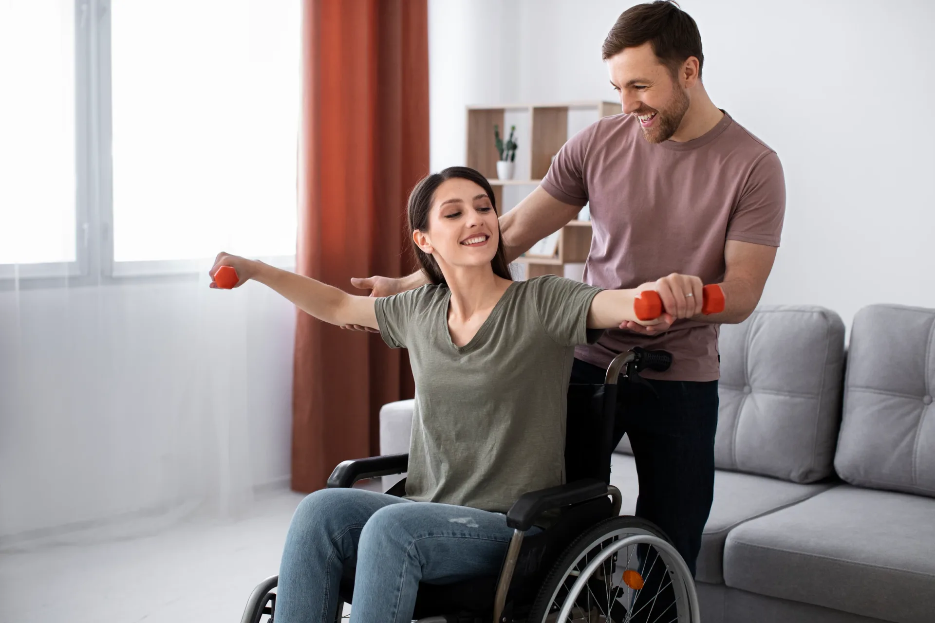 Young adult support worker assisting a person with disability