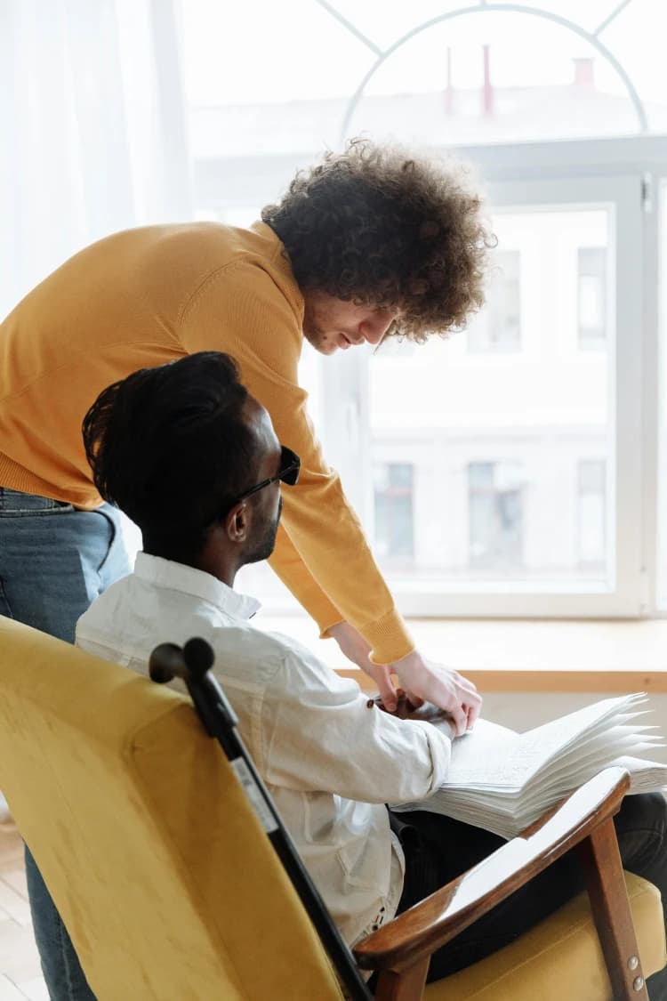Support worker helping a person with disability